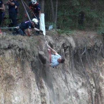 GALLERY: See how firefighters rescued man, injured dog from 50-foot ravine in Conroe