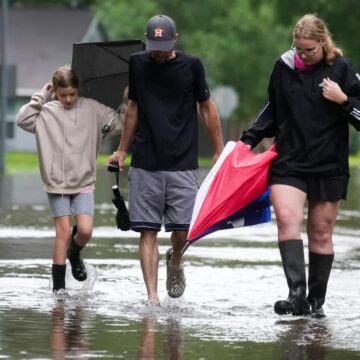 Heavy rains near Houston close schools and flood roadways as officials urge residents to evacuate